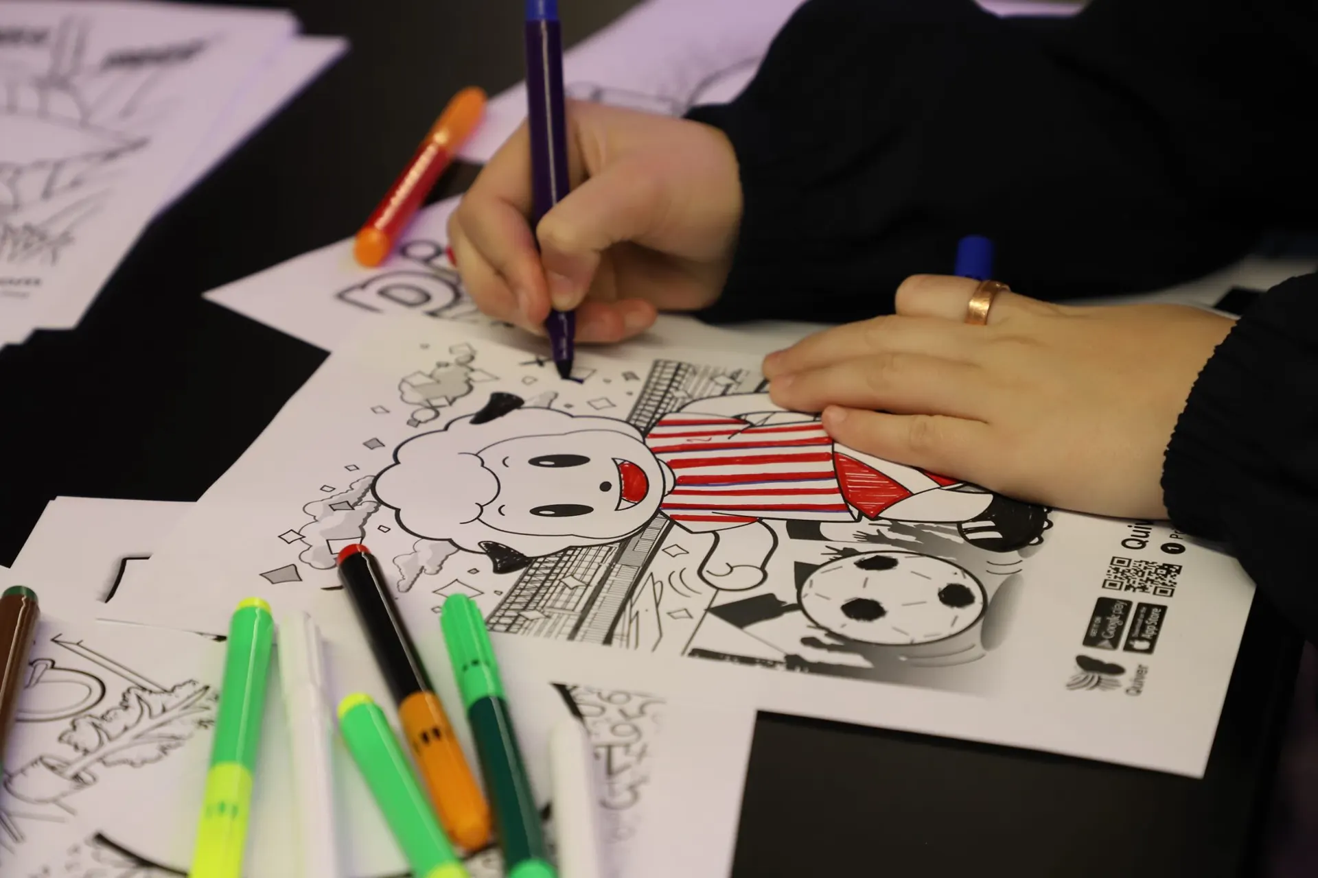 Close-up of a hand sketching ideas on paper during a She Sharp session.