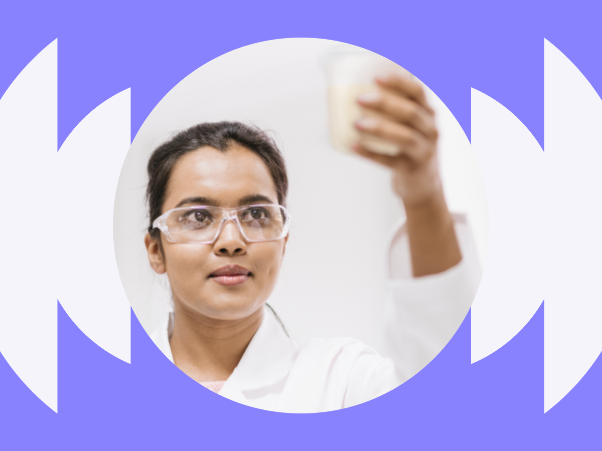 Women scientist standing with arms crossed in a lab